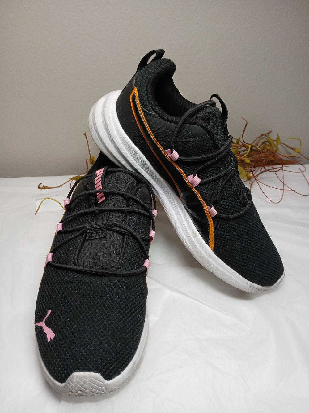 Puma Black Sneakers with Pink Accents and Orange Trim
